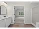 Bathroom showcases a shower and double vanity at 1876 Hamby Place Nw Dr, Acworth, GA 30102