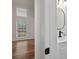 Bathroom featuring a modern sink vanity with an oval mirror, adjacent to a bedroom with a window at 1876 Hamby Place Nw Dr, Acworth, GA 30102