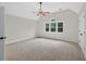 Bright bedroom with a large window and neutral paint at 1876 Hamby Place Nw Dr, Acworth, GA 30102