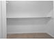 Empty closet with a shelf and carpet at 1876 Hamby Place Nw Dr, Acworth, GA 30102