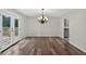 Cozy dining area with wood floors and access to the outdoor deck at 1876 Hamby Place Nw Dr, Acworth, GA 30102