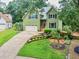 Charming two-story home with a well-maintained lawn and a two-car garage at 1876 Hamby Place Nw Dr, Acworth, GA 30102