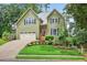 Charming two-story home with a well-manicured lawn and inviting curb appeal at 1876 Hamby Place Nw Dr, Acworth, GA 30102