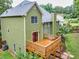 Rear exterior featuring an elevated wooden deck, perfect for outdoor entertaining at 1876 Hamby Place Nw Dr, Acworth, GA 30102