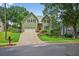 Two-story home with green siding, shutters, and a manicured lawn, showcasing curb appeal at 1876 Hamby Place Nw Dr, Acworth, GA 30102