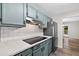 Modern kitchen with stainless steel refrigerator, smooth cooktop and white tiled backsplash at 1876 Hamby Place Nw Dr, Acworth, GA 30102