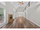 Bright living room featuring a stone fireplace, hardwood floors, vaulted ceiling and an upstairs railing at 1876 Hamby Place Nw Dr, Acworth, GA 30102