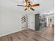 Open-concept living room and kitchen with hardwood floors and a ceiling fan at 1876 Hamby Place Nw Dr, Acworth, GA 30102