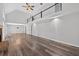 Spacious living room showcasing hardwood floors, stone fireplace, vaulted ceiling, and upstairs railing at 1876 Hamby Place Nw Dr, Acworth, GA 30102