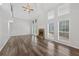 Inviting living room features wood floors, a fireplace, and large windows for natural light at 1876 Hamby Place Nw Dr, Acworth, GA 30102