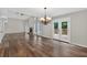 Open floor plan with a vaulted ceiling, wood floors, and fireplace creates a cozy space at 1876 Hamby Place Nw Dr, Acworth, GA 30102