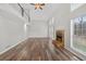 Bright living room features wood floors, a fireplace, and large windows for natural light at 1876 Hamby Place Nw Dr, Acworth, GA 30102