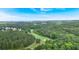 Stunning aerial view of a lush golf course nestled within a serene, wooded landscape at 212 Thorncliff Way Way, Acworth, GA 30101
