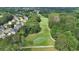 Scenic aerial view of a golf course with lush greenery and a pond at 212 Thorncliff Way Way, Acworth, GA 30101