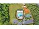 Aerial view of a pool and recreational area surrounded by mature trees in a residential community at 212 Thorncliff Way Way, Acworth, GA 30101