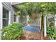 Relaxing back patio shaded by a tree, featuring a blue patterned rug at 212 Thorncliff Way Way, Acworth, GA 30101