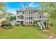 Expansive backyard featuring a multi-level deck, lush lawn, and mature landscaping, perfect for outdoor entertaining at 212 Thorncliff Way Way, Acworth, GA 30101