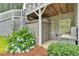 The home features a shed with a backyard view framed by hydrangea bushes and landscaping at 212 Thorncliff Way Way, Acworth, GA 30101