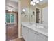 Bathroom boasts double sinks and white cabinetry with access to the main bedroom at 212 Thorncliff Way Way, Acworth, GA 30101