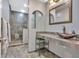Bathroom with a walk-in shower that has mixed stone tile work, a vessel sink and bronze fixtures at 212 Thorncliff Way Way, Acworth, GA 30101