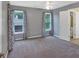 Bedroom featuring neutral carpet, two windows, and decorative curtains at 212 Thorncliff Way Way, Acworth, GA 30101