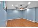 Large bonus room with modern lighting, hardwood floors, and ample space for versatile use at 212 Thorncliff Way Way, Acworth, GA 30101