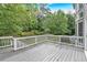 The deck offers a view of the lush landscaping at 212 Thorncliff Way Way, Acworth, GA 30101