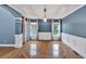 Formal dining room featuring hardwood floors, chandelier, and classic wainscoting at 212 Thorncliff Way Way, Acworth, GA 30101