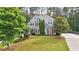 Beautiful two-story home featuring a well-manicured lawn and a mix of brick and siding at 212 Thorncliff Way Way, Acworth, GA 30101