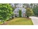 Beautiful brick two-story home featuring a well-manicured lawn and professional landscaping at 212 Thorncliff Way Way, Acworth, GA 30101