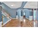 Spacious foyer featuring hardwood floors, beautiful archways, and staircase at 212 Thorncliff Way Way, Acworth, GA 30101