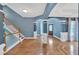 Grand foyer with hardwood floors, archways, staircase, and classic architectural details at 212 Thorncliff Way Way, Acworth, GA 30101