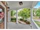 Inviting front porch with classic columns, decorative wreath, and view of landscaped yard at 212 Thorncliff Way Way, Acworth, GA 30101