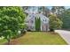 Charming two-story home with landscaped front yard, mature trees, and traditional architecture at 212 Thorncliff Way Way, Acworth, GA 30101
