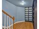 Hallway with hardwood floors, built in shelving, and white trim at 212 Thorncliff Way Way, Acworth, GA 30101