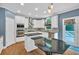 Bright kitchen with stainless appliances, gas range, custom cabinetry, hardwood floors, and an island with bar seating at 212 Thorncliff Way Way, Acworth, GA 30101