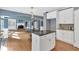 Gourmet kitchen with a center island, hardwood floors, white cabinetry, and stainless steel appliances at 212 Thorncliff Way Way, Acworth, GA 30101