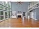 Grand living room with floor-to-ceiling windows, fireplace, and an open layout ideal for entertaining guests at 212 Thorncliff Way Way, Acworth, GA 30101