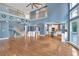 Open-concept living room featuring hardwood floors, a fireplace, and an open view to the kitchen at 212 Thorncliff Way Way, Acworth, GA 30101