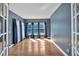 Bright living room boasting hardwood floors, large windows, and elegant curtains at 212 Thorncliff Way Way, Acworth, GA 30101