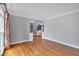 Open-concept living area featuring hardwood floors, archways, and plenty of natural light at 212 Thorncliff Way Way, Acworth, GA 30101
