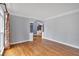 Bright living room featuring crown molding, archway details and beautiful hardwood flooring at 212 Thorncliff Way Way, Acworth, GA 30101