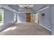 Large main bedroom features a vaulted ceiling, a ceiling fan, neutral carpet and barn door to en-suite at 212 Thorncliff Way Way, Acworth, GA 30101