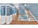 Elegant staircase featuring hardwood steps, white railings, and stylish architectural design at 212 Thorncliff Way Way, Acworth, GA 30101