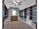 Large walk-in closet featuring custom built-in shelving, ample storage, and overhead lighting at 212 Thorncliff Way Way, Acworth, GA 30101