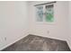 A sunny bedroom features a window, neutral walls and soft carpet at 2459 Cedar Canyon Se Ct, Marietta, GA 30067