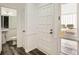 Bright entryway features classic white trim, wood floors, and a view into the bathroom at 2459 Cedar Canyon Se Ct, Marietta, GA 30067