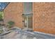Inviting brick exterior with a well-lit front door and tidy landscaping at 2459 Cedar Canyon Se Ct, Marietta, GA 30067