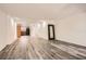 Open living area featuring wood-look flooring, white walls, and a view of the kitchen at 2459 Cedar Canyon Se Ct, Marietta, GA 30067