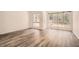 Inviting living room featuring wood-look floors, many windows, and ample space at 2459 Cedar Canyon Se Ct, Marietta, GA 30067